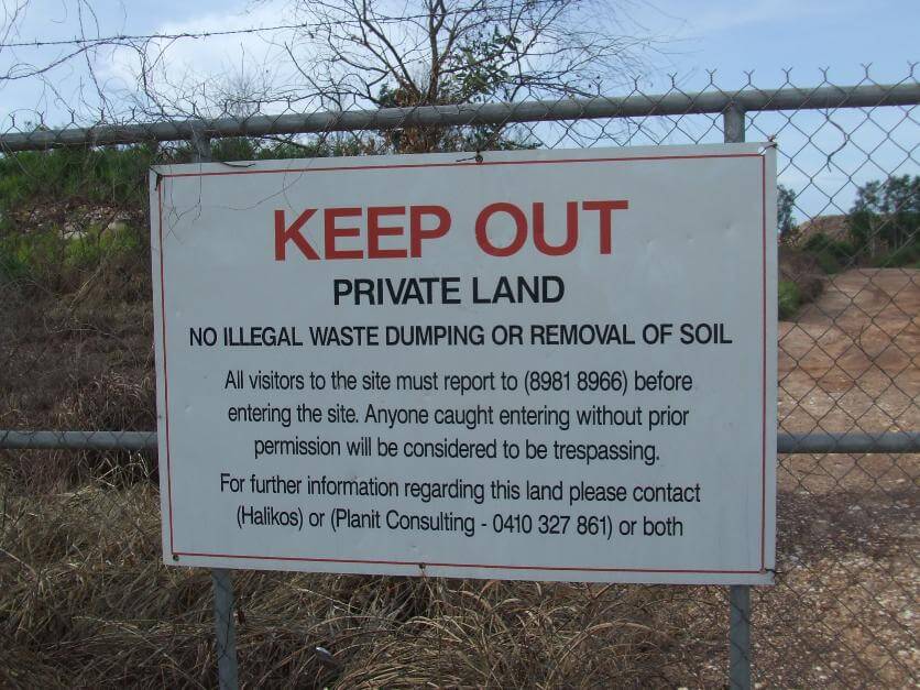 A sign captured by Dr Bill Day on the fence of the dumping ground in Ludmilla. Picture: Bill Day. 