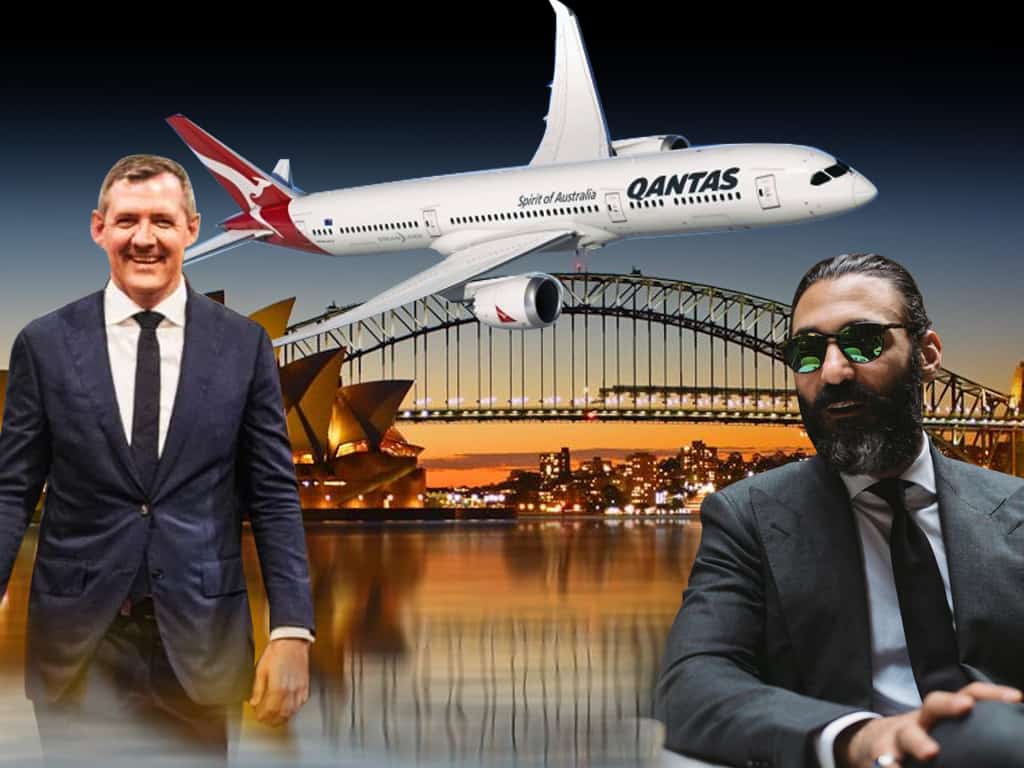 Chief Minister Michael Gunner and tailor Roger Shamoun with a Qantas plane and Sydney as the backdrop